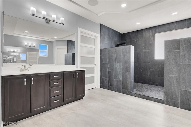 full bathroom with vanity, recessed lighting, and a walk in shower