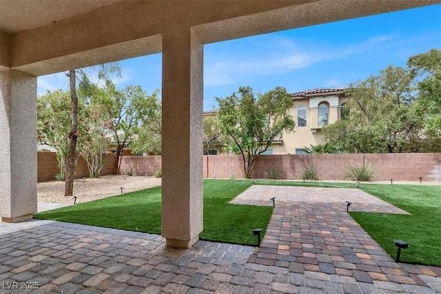 view of yard with a fenced backyard and a patio area
