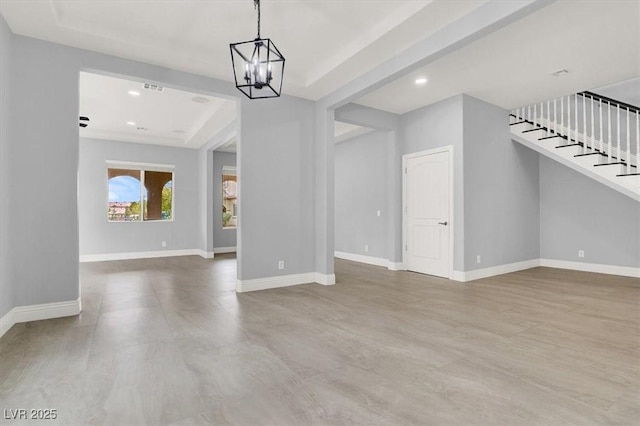 unfurnished dining area with visible vents, baseboards, stairway, recessed lighting, and a notable chandelier