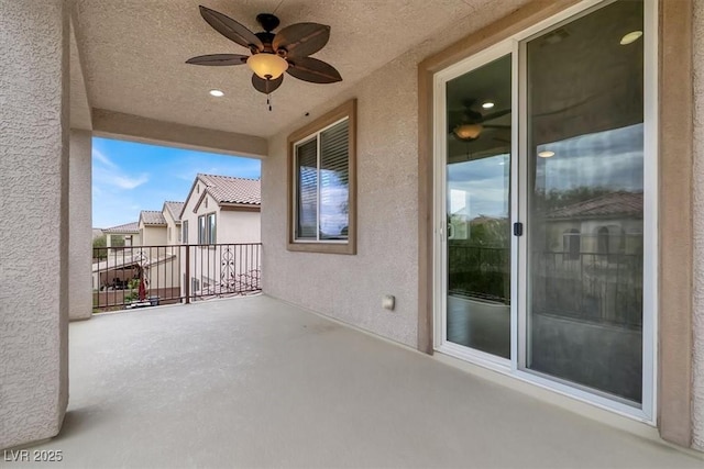 exterior space with ceiling fan