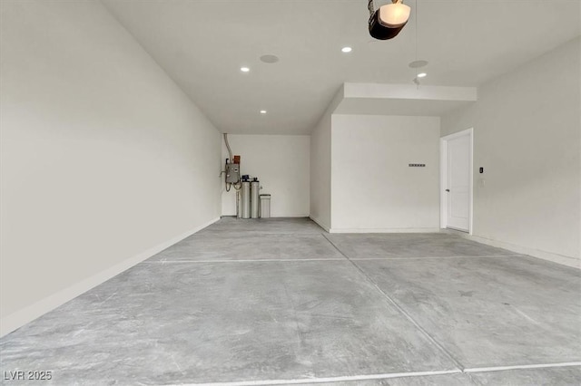 garage featuring recessed lighting and a garage door opener