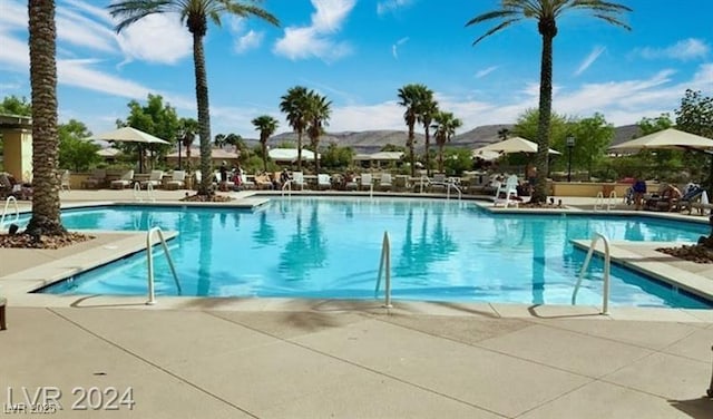 pool with a patio area