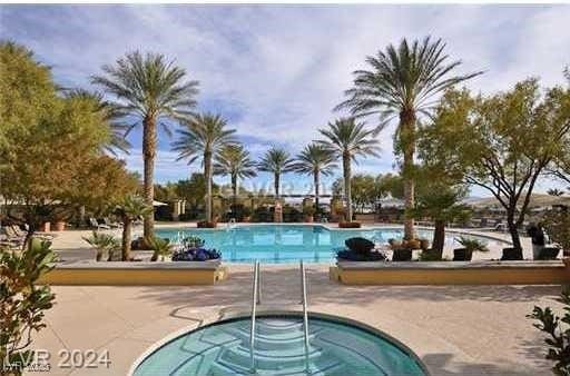 community pool with a community hot tub