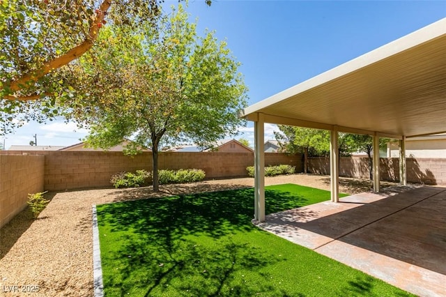 view of yard featuring a patio and a fenced backyard