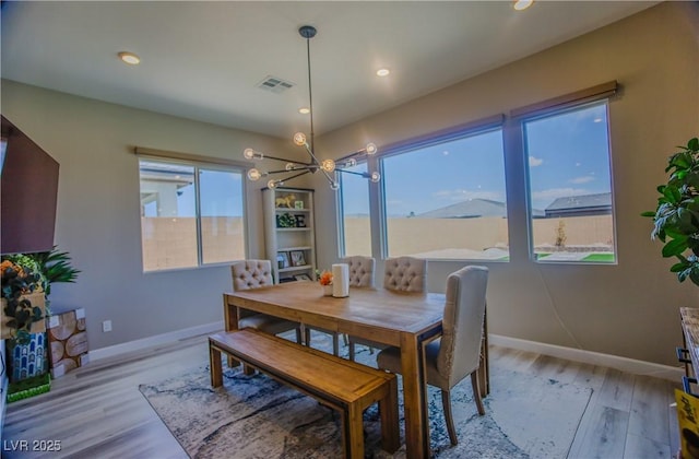 8310 W Camero Ave, Las Vegas, NV 89113 - dining space with baseboards, recessed lighting, light wood-style flooring, and a chandelier