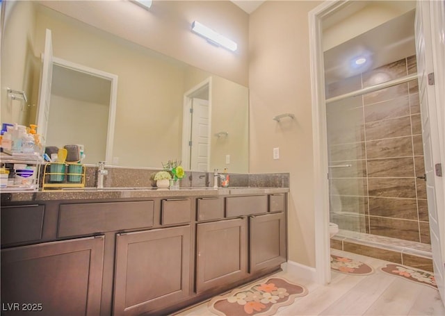 8310 W Camero Ave, Las Vegas, NV 89113 - bathroom with double vanity, a sink, toilet, and a shower stall