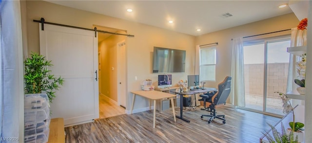 8310 W Camero Ave, Las Vegas, NV 89113 - office featuring visible vents, a barn door, wood finished floors, baseboards, and recessed lighting