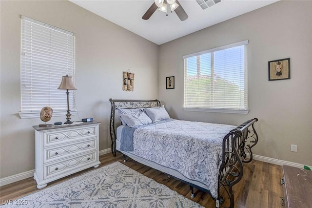 9243 White Waterfall Ave, Las Vegas, NV 89149 - bedroom featuring baseboards, wood finished floors, and a ceiling fan