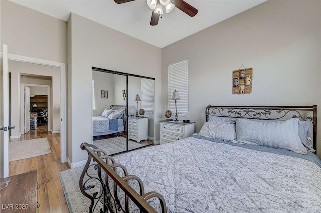 9243 White Waterfall Ave, Las Vegas, NV 89149 - bedroom featuring wood finished floors, a closet, baseboards, and ceiling fan
