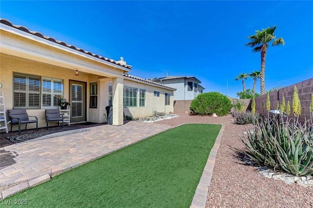 9243 White Waterfall Ave, Las Vegas, NV 89149 - fenced backyard with a patio area