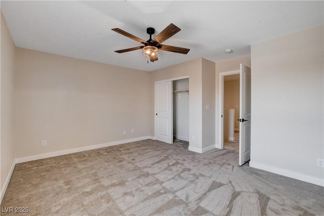 unfurnished bedroom featuring baseboards, carpet flooring, and a closet