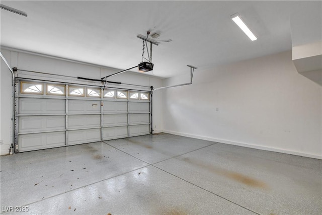 garage featuring baseboards and a garage door opener