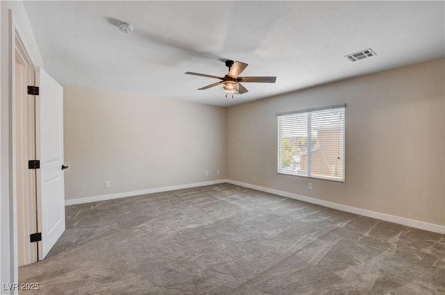 unfurnished room featuring visible vents, a ceiling fan, baseboards, and carpet floors