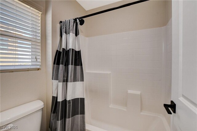 full bath featuring shower / bath combo and toilet