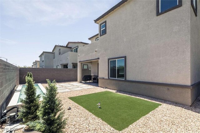 view of yard with a fenced backyard and a patio area