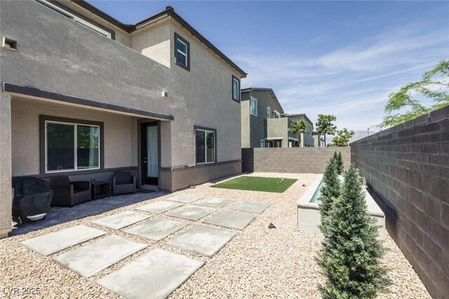 exterior space with a fenced backyard