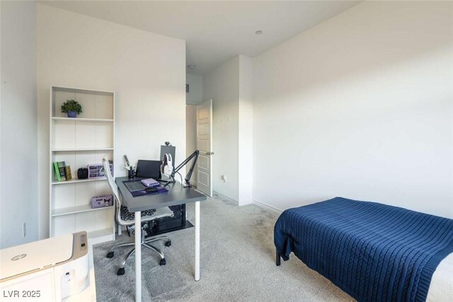 carpeted bedroom featuring baseboards