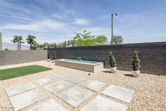 view of patio with a fenced backyard