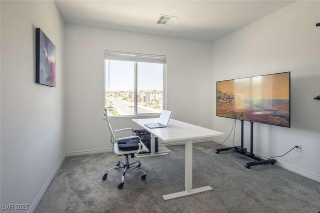 carpeted office space with baseboards and visible vents