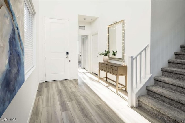 9732 Abel Cliff St, Las Vegas, NV 89143 - entryway featuring stairs and wood finished floors