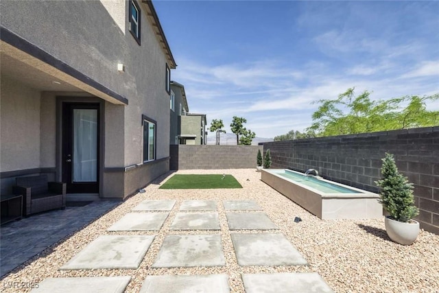 9732 Abel Cliff St, Las Vegas, NV 89143 - fenced backyard with a patio