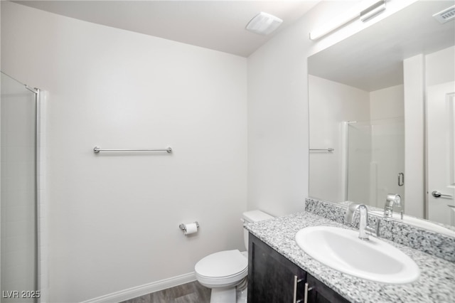 bathroom with an enclosed shower, toilet, visible vents, and wood finished floors