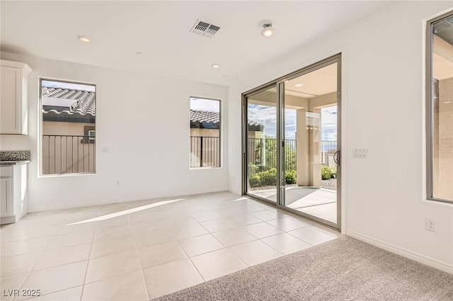 58 Sun Lily Ln, Henderson, NV 89011 - spare room with light tile patterned floors, visible vents, and recessed lighting