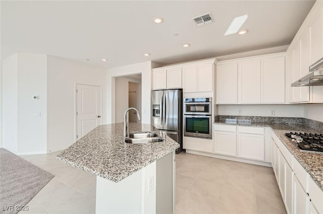 58 Sun Lily Ln, Henderson, NV 89011 - kitchen with a sink, a kitchen island with sink, white cabinetry, visible vents, and appliances with stainless steel finishes