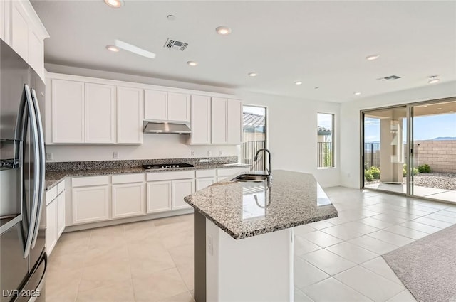 58 Sun Lily Ln, Henderson, NV 89011 - kitchen with fridge with ice dispenser, a wealth of natural light, visible vents, and a sink