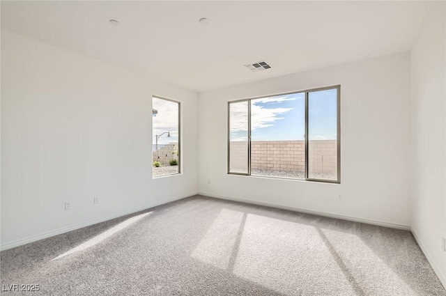 58 Sun Lily Ln, Henderson, NV 89011 - spare room with light colored carpet, baseboards, and visible vents