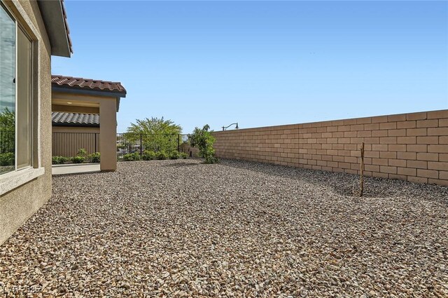 58 Sun Lily Ln, Henderson, NV 89011 - view of yard with a fenced backyard