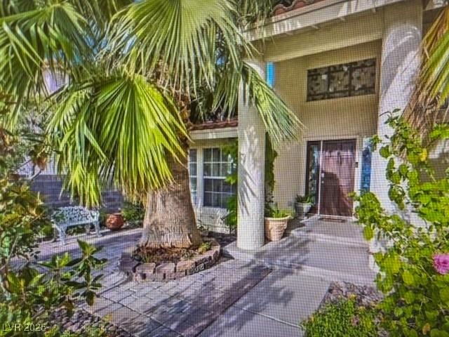 390 Rushing Creek Ct, Henderson, NV 89014 - view of exterior entry featuring brick siding