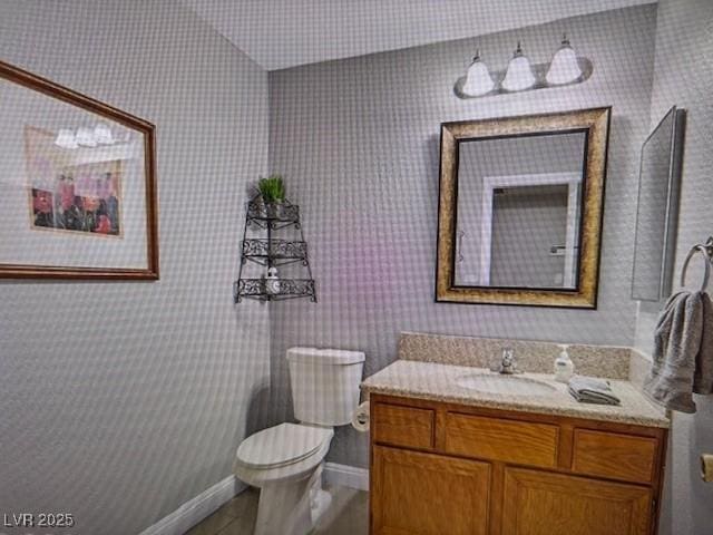 390 Rushing Creek Ct, Henderson, NV 89014 - half bathroom with toilet, vanity, baseboards, and wood finished floors
