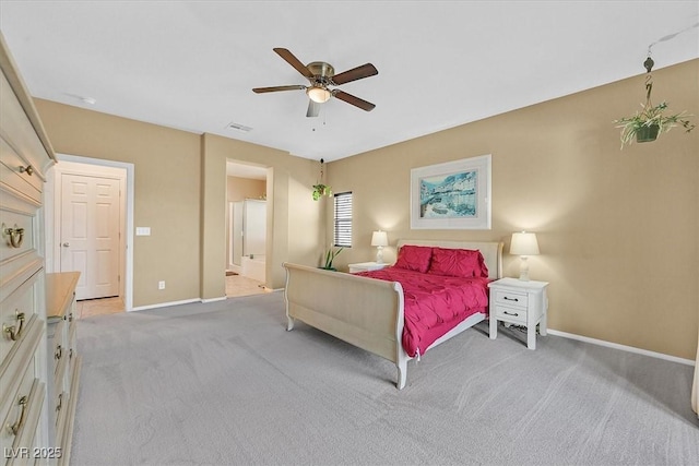 5226 Lignum Ave Unit 1, Pahrump, NV 89061 - bedroom with visible vents, light carpet, baseboards, ensuite bathroom, and ceiling fan