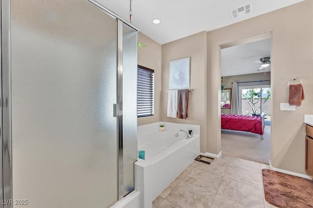 5226 Lignum Ave Unit 1, Pahrump, NV 89061 - ensuite bathroom featuring connected bathroom, vanity, visible vents, a bath, and a stall shower