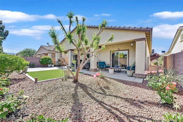 5226 Lignum Ave Unit 1, Pahrump, NV 89061 - rear view of house with fence, a patio area, and stucco siding