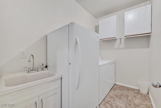 5226 Lignum Ave Unit 1, Pahrump, NV 89061 - washroom featuring marble finish floor, baseboards, separate washer and dryer, a sink, and cabinet space