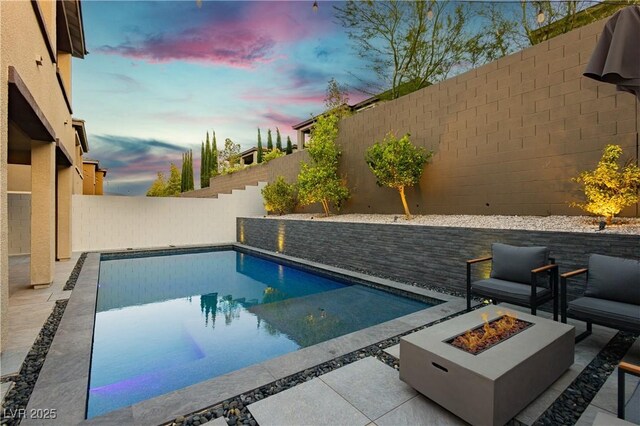 881 Cherry Glen Pl, Las Vegas, NV 89138 - view of swimming pool with an outdoor fire pit, a fenced backyard, and a patio