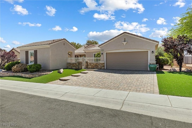 2164 Sawtooth Mountain Dr, Henderson, NV 89044 - ranch-style home featuring fence, a garage, stucco siding, a front yard, and decorative driveway