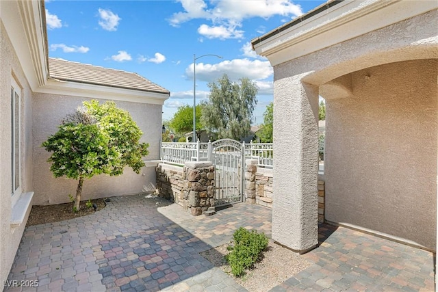 2164 Sawtooth Mountain Dr, Henderson, NV 89044 - view of patio / terrace with fence and a gate