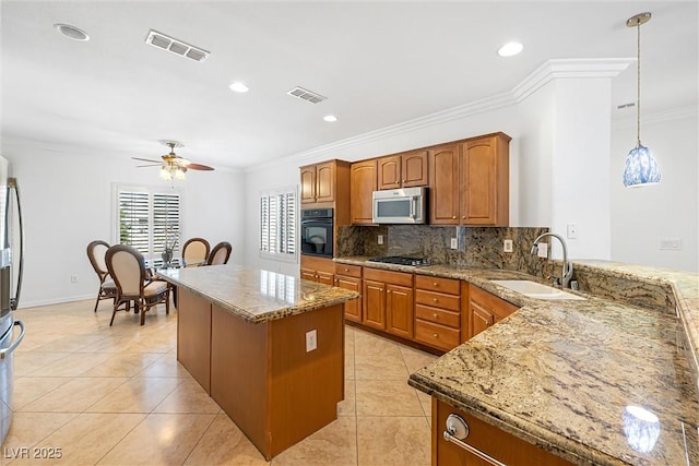 2164 Sawtooth Mountain Dr, Henderson, NV 89044 - kitchen featuring a sink, stainless steel microwave, black oven, and visible vents