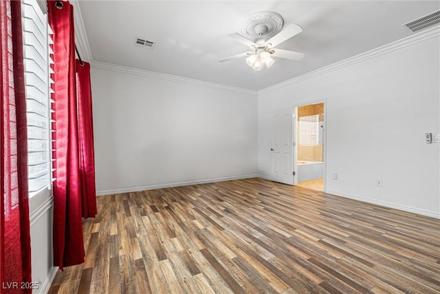2164 Sawtooth Mountain Dr, Henderson, NV 89044 - empty room featuring crown molding, ceiling fan, wood finished floors, and visible vents