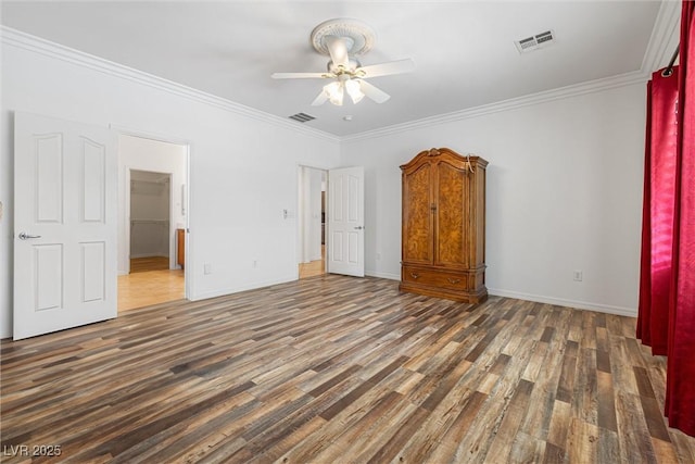 2164 Sawtooth Mountain Dr, Henderson, NV 89044 - unfurnished bedroom with crown molding, wood finished floors, and visible vents