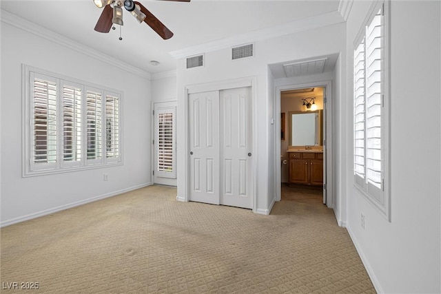 2164 Sawtooth Mountain Dr, Henderson, NV 89044 - unfurnished bedroom featuring visible vents, crown molding, and light carpet