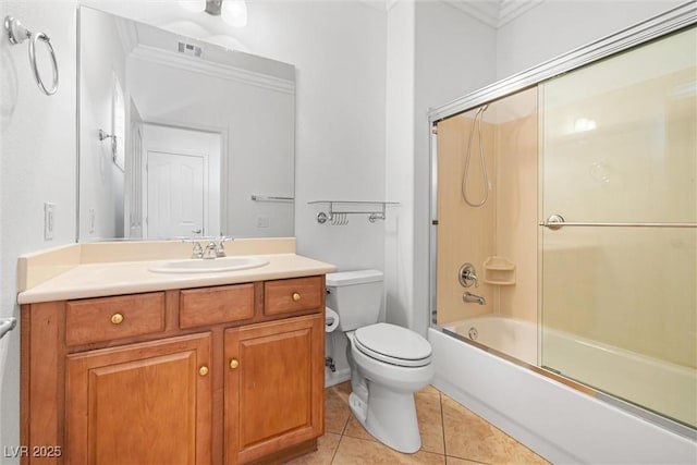 2164 Sawtooth Mountain Dr, Henderson, NV 89044 - bathroom with crown molding, tile patterned flooring, vanity, bath / shower combo with glass door, and toilet