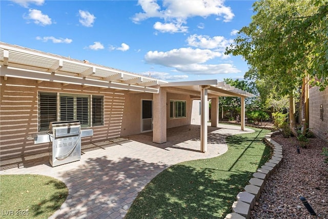 2164 Sawtooth Mountain Dr, Henderson, NV 89044 - rear view of house featuring a pergola, fence, a patio, and stucco siding