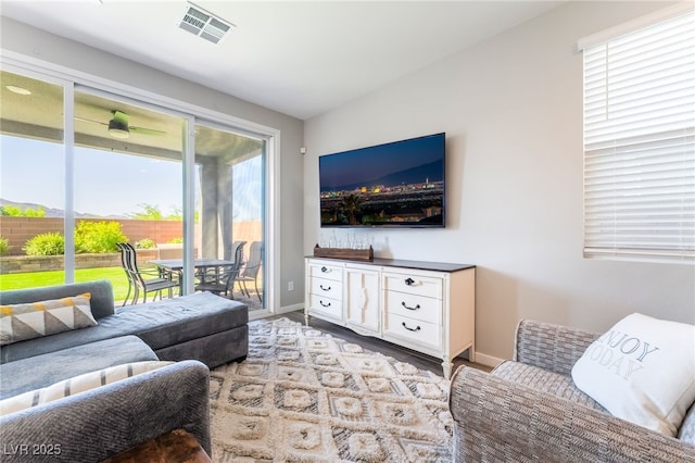 23 Strada Barbera, Henderson, NV 89011 - living area featuring wood finished floors, healthy amount of natural light, and baseboards