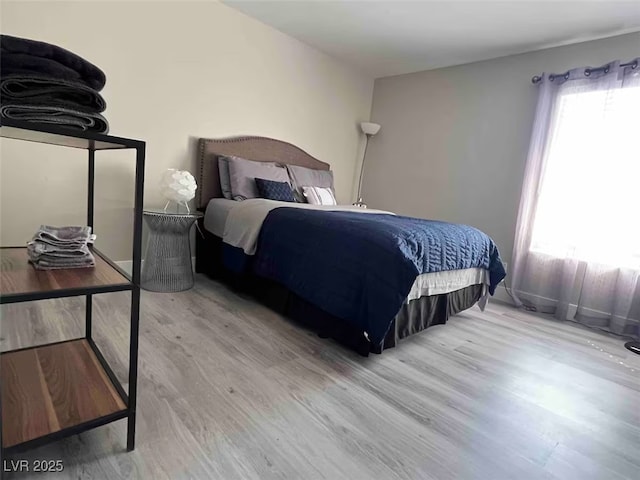 bedroom with wood finished floors