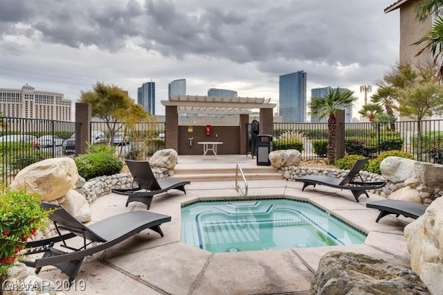 view of swimming pool featuring a patio area, fence, and a pergola