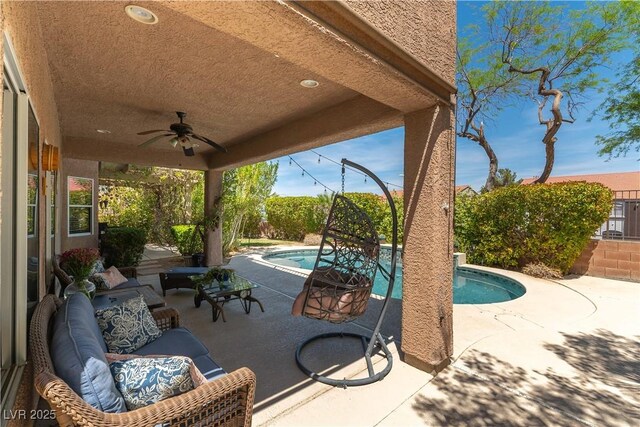 view of patio / terrace with a ceiling fan, outdoor lounge area, and an outdoor pool
